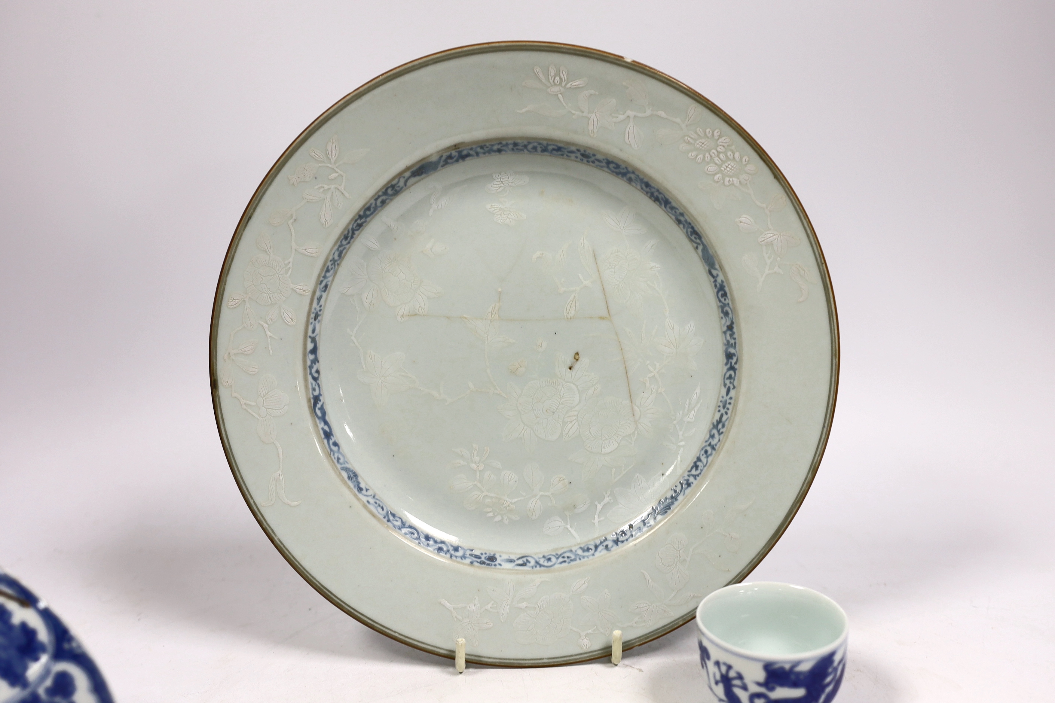 A Chinese bianco sopra bianco plate, diameter 23cm, and two blue and white small pots